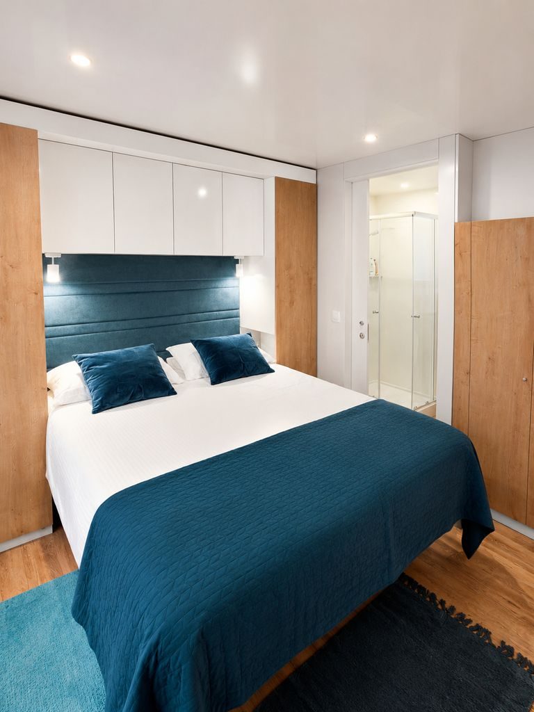Main bedroom with a double bed and built-in storage