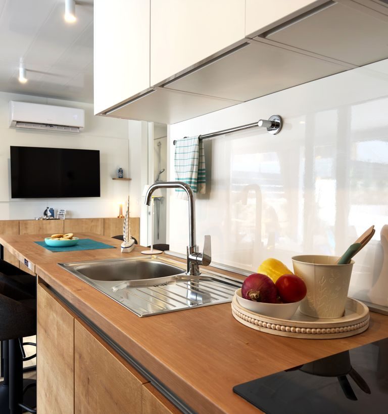 Modern kitchen with a wood worktop, sink and built-in cabinetry