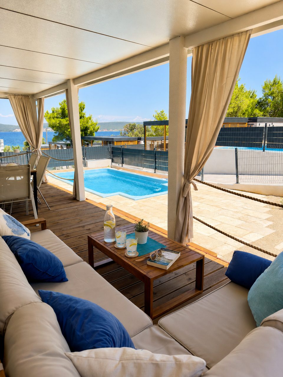 Covered terrace beside the private heated pool at Salvia Beachside Homes